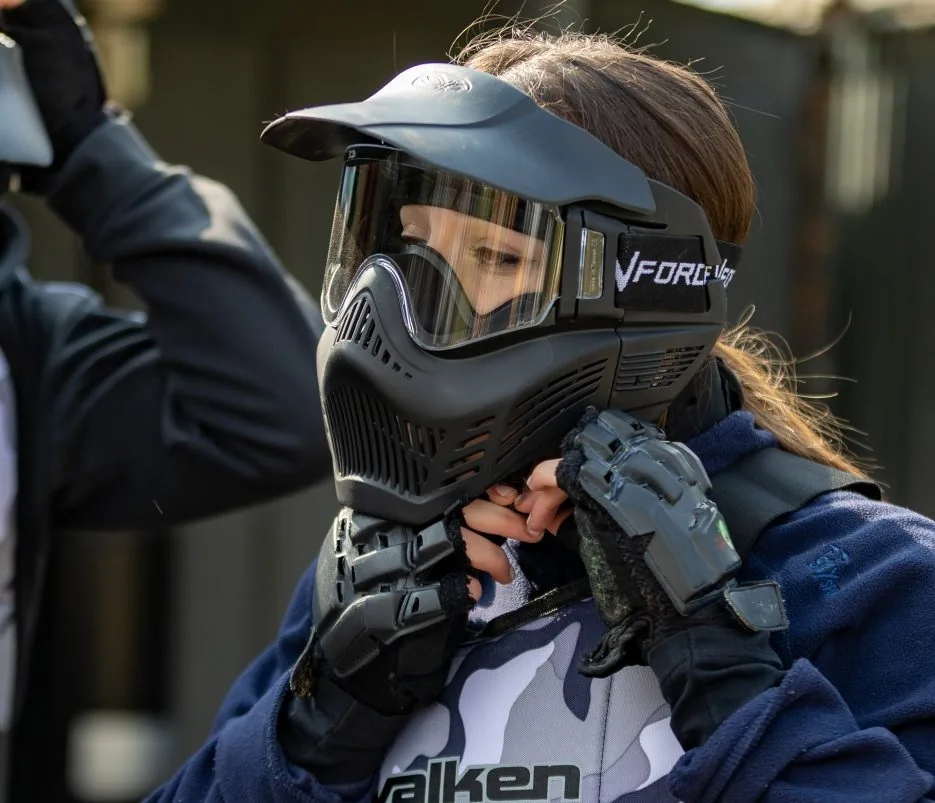 A student putting on her protective mask before the game