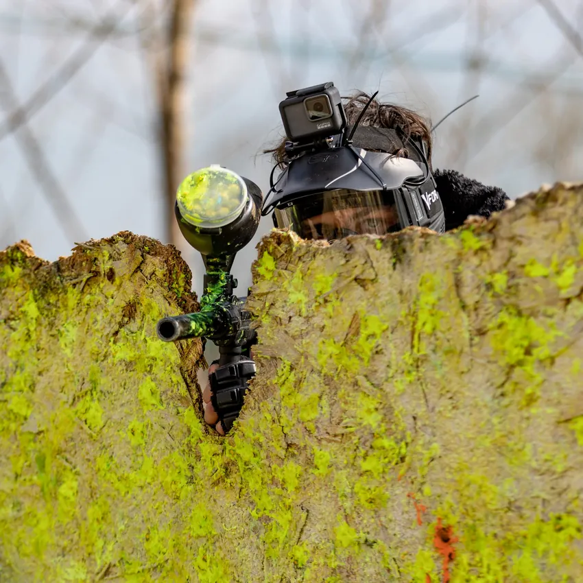A player taking aim over a barricade